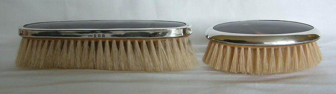 pair of tortoiseshell and sterling silver brushes Birmingham 1925 and 1926
